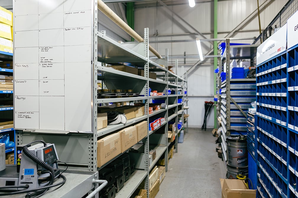 Smiling employee in the Parts Inventory